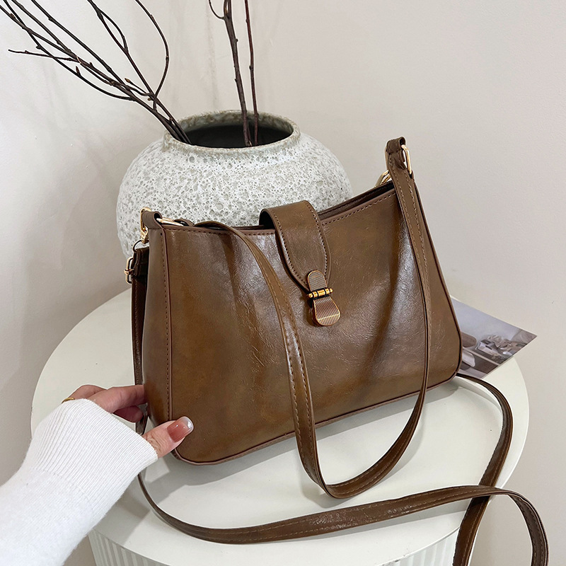 Nichezhong retro simple bolso de brazo bolso de mujer 2025 primavera nueva moda bolso pequeño de viaje de moda mochila de hombro