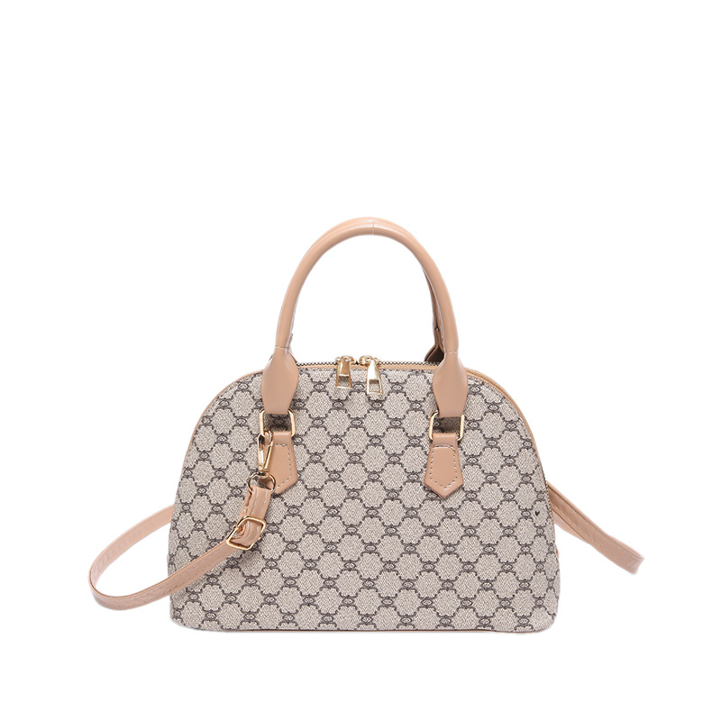 Bolso de moda simple 2024 primavera nueva bolsa de hombro de viaje de estilo extranjero bolso de mano casual bolso de concha de mujer