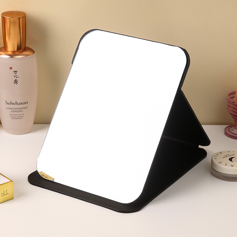Espejo plegable de cuero PU Dormitorio de estudiantes Espejo de maquillaje de belleza de estilo princesa Espejo de tocador simple de escritorio para el hogar