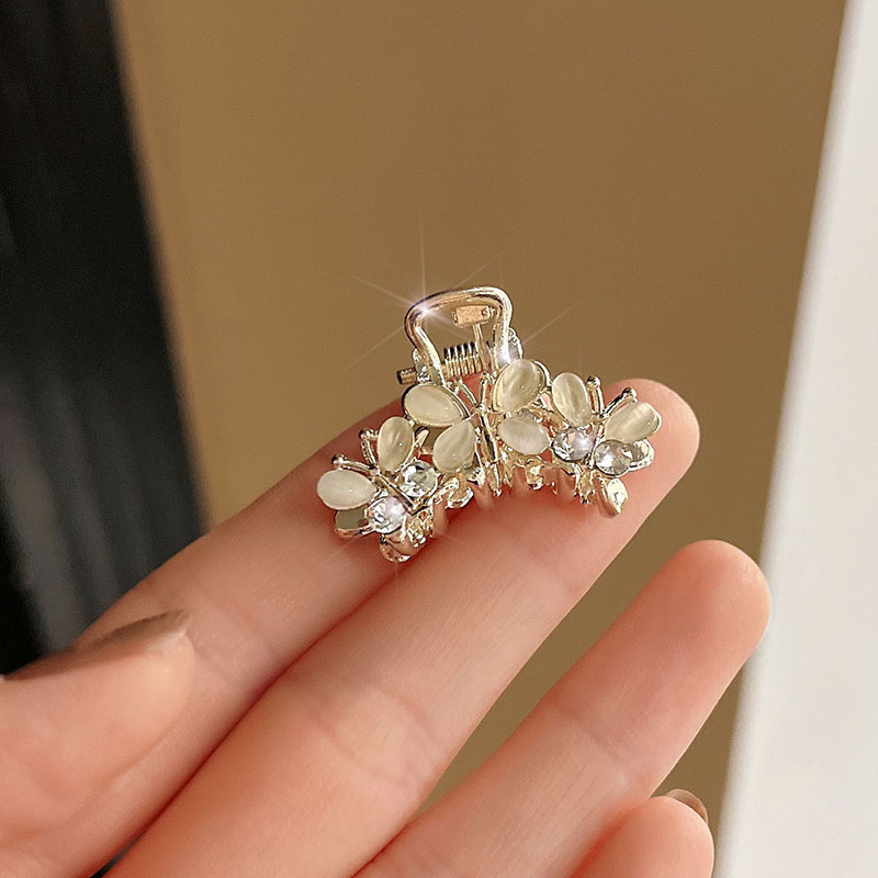 Ojo de gato tres mariposas-oro