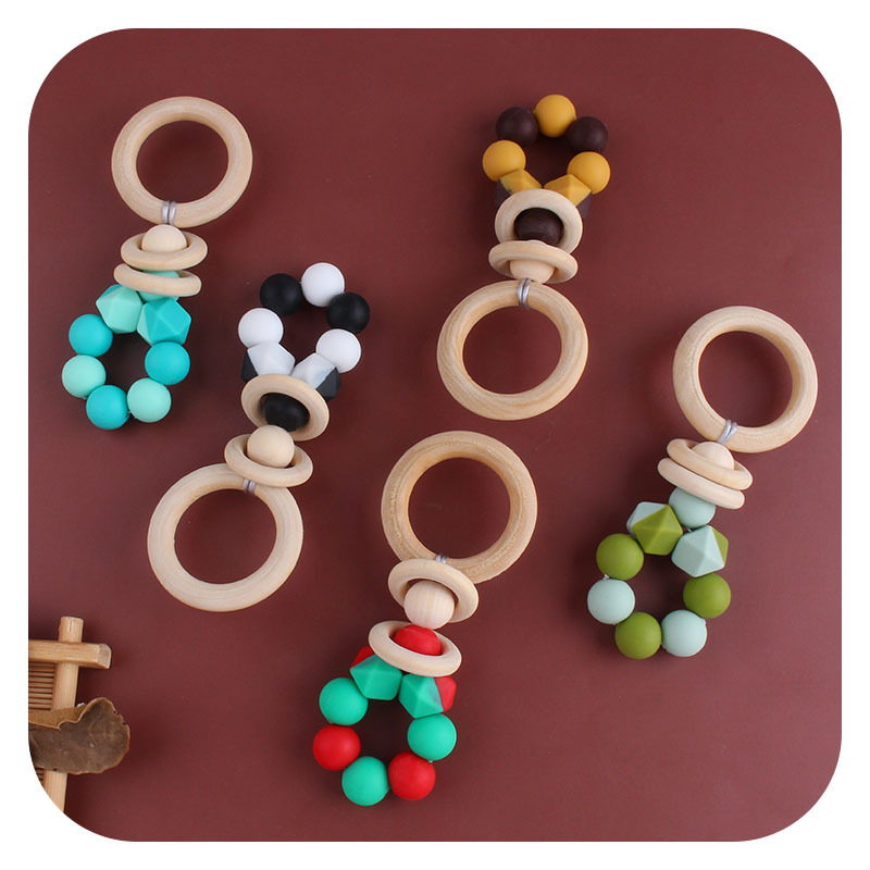 Nuevos suministros para bebés DIY creativo anillo de madera mordedor bebé calmante de dos colores de silicona de juguete dientes de molienda palo