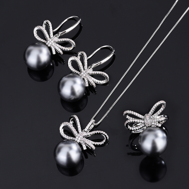 Zhuang Sheng joyería cobre inferior chapado en oro nuevo gris con incrustaciones rebordear moda arco diamante traje femenino 14mm