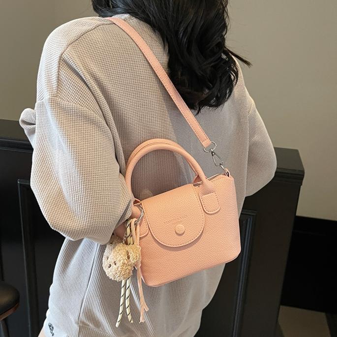 Bolsos pequeños de mano más vendidos de comercio exterior para mujer 2025 nuevo bolso cuadrado pequeño simple y todo fósforo textura casual bolso de mensajero de un solo hombro