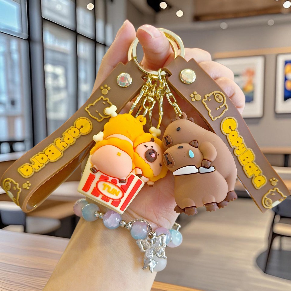 Nuevo llavero de Kapibala pareja mochila escolar colgante lindo capibara muñeca de PVC llavero de coche al por mayor