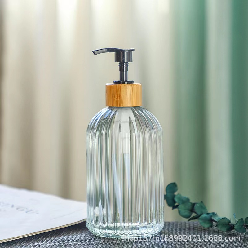 Botella de emulsión de vidrio de lujo ligeramente nórdica botella de jabón de presión botella de champú de baño de alto valor facial