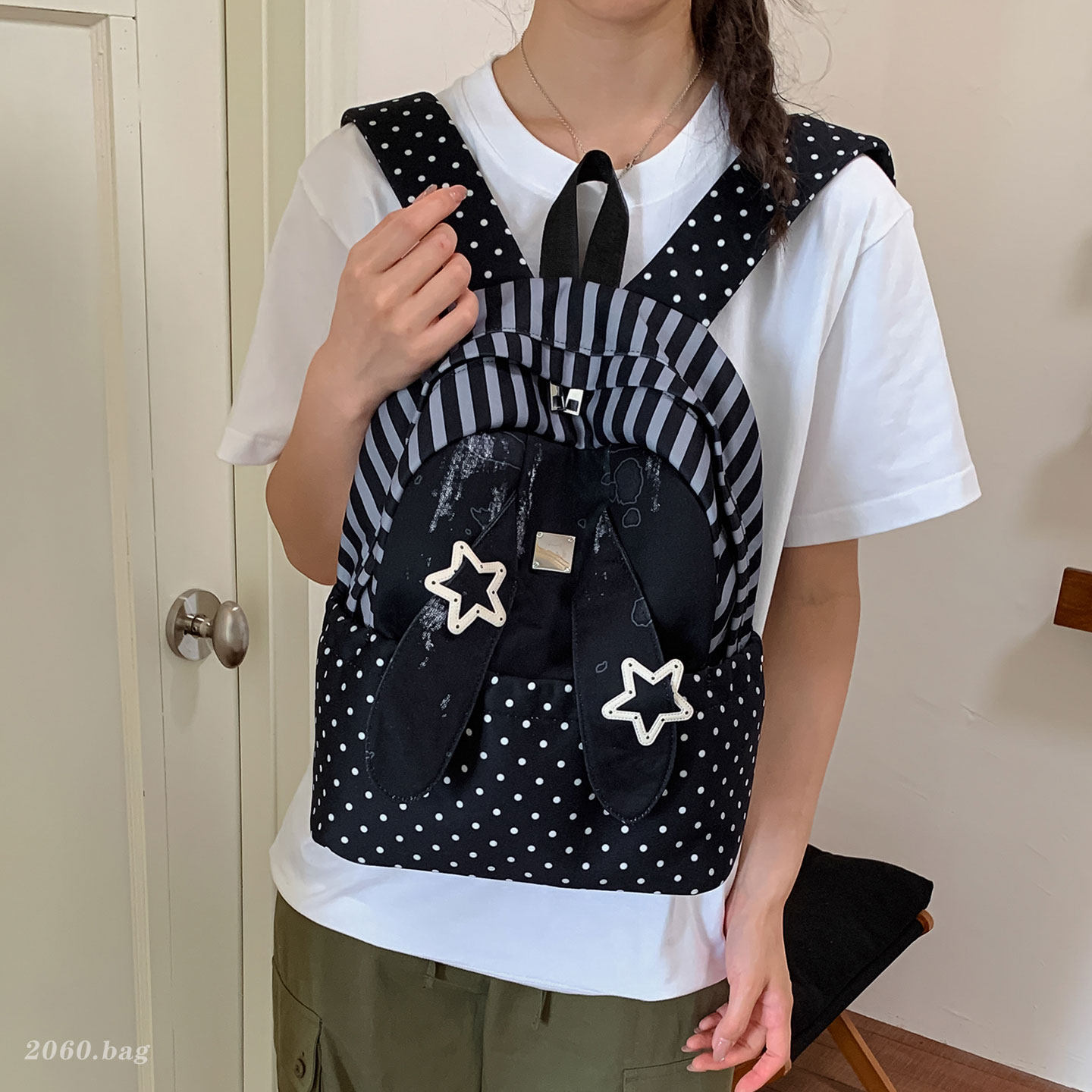 Universales estudiantes lindos clase de nicho ligero 2026 nuevas orejas de gran capacidad mochila de mujer mochila de punto de onda conejo