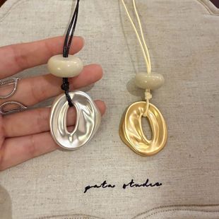 New Autumn and Winter Soft Rope Hole Pendant Necklace Women's Niche Design High-end Fashion Hollow Pendant Long Woolen Chain