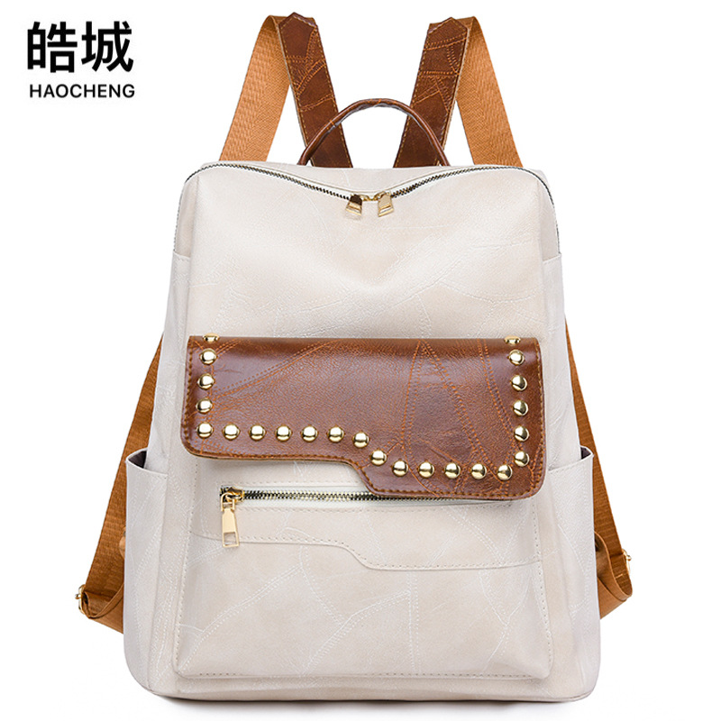 Mochila de cuero suave para mujer casual de nuevo estilo transfronterizo, moda, lujo ligero, viajero urbano, color de contraste, mochila de viaje, marea al por mayor