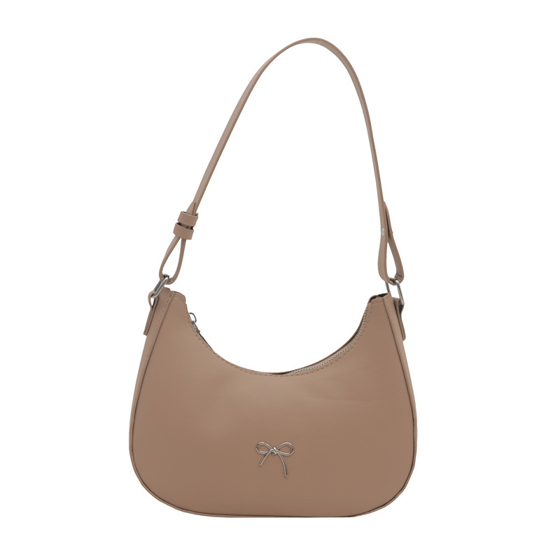 Bolso de axila con lazo para mujer 2024 nuevo estilo literario minimal bolso de hombro textura de viaje de moda de luna nueva marea