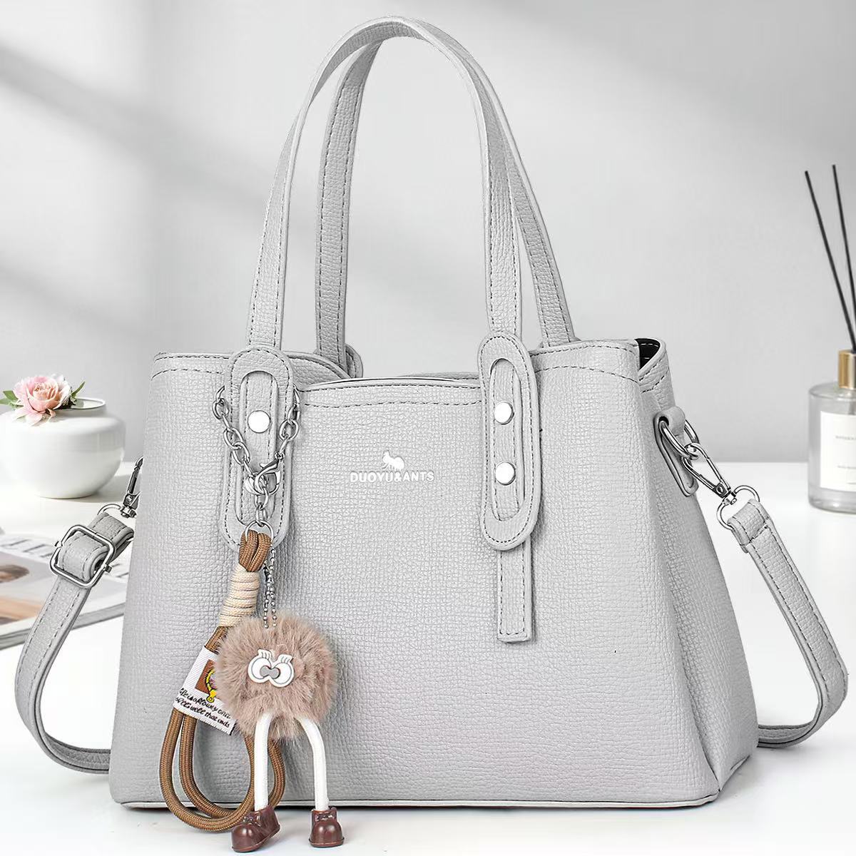 Casual muñeca colgante bolsos de mano simple bolsos de hombro de color sólido bolsos de moda bolsos transfronterizos