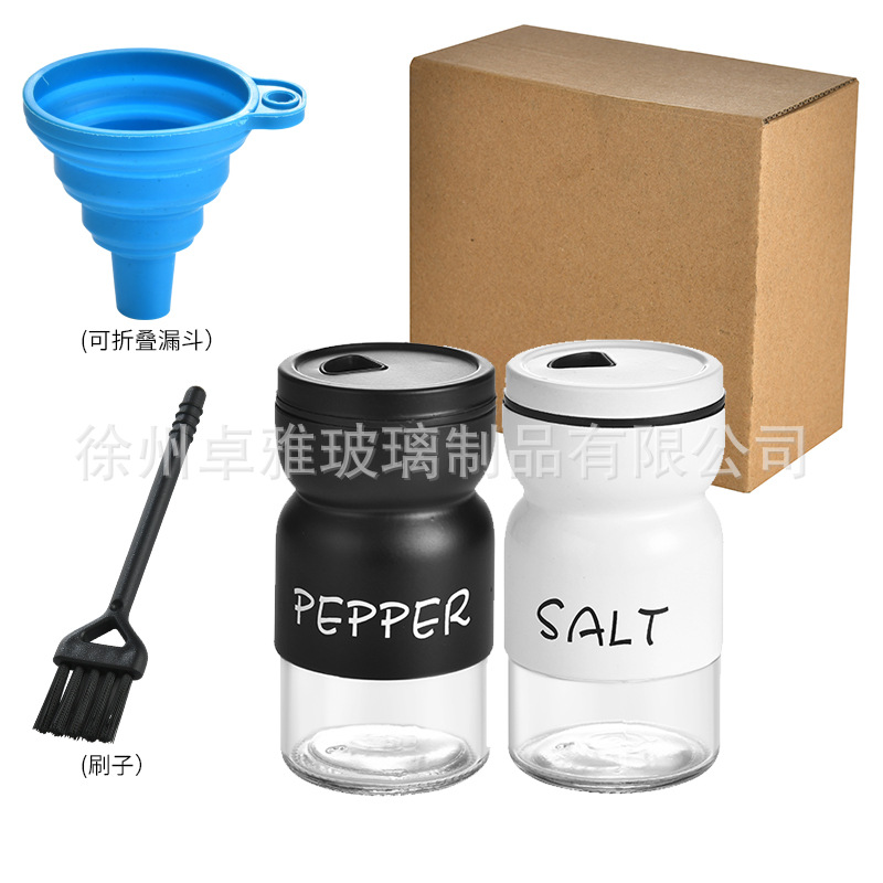Botella de condimento transfronterizo de pimienta, sal y pimienta Botella de condimento redonda giratoria Combinación en blanco y negro Juego a prueba de humedad Tarro de condimento de vidrio