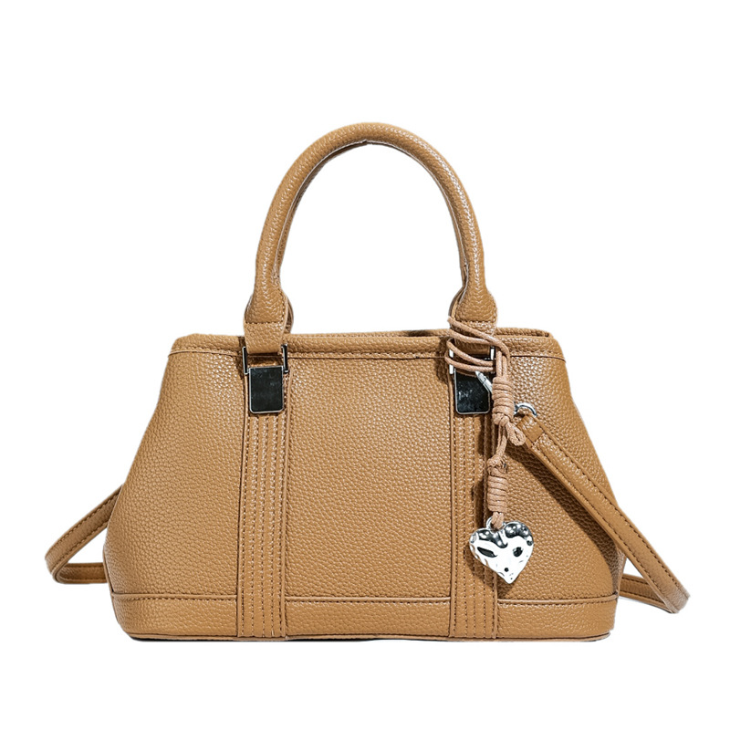 Versión coreana del bolso de nicho 2025 verano nuevo bolso femenino retro patrón de lichi bolso de hombro diario mensajero de viaje