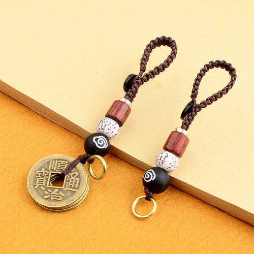 Embrace the power of the Five Emperors' coins with this lucky charm keychain, featuring a hand-woven rope, turning wheel, and vibrant design. Perfect as a retro-style accessory for keys, adding a creative and mystical touch to your everyday life.