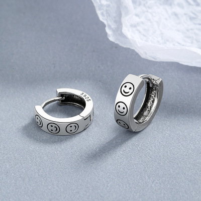 Korean Edition the republic of korea Earrings Backing Ear Studs Earrings Year of fate Smiling face Thai Silver Female models Sense of design Jewelry wholesale