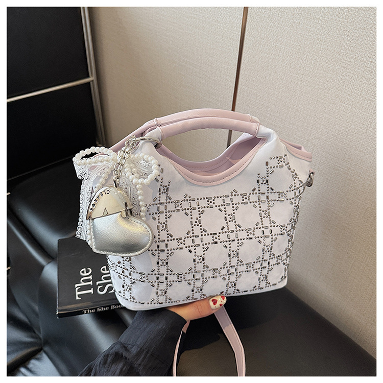 Summer fashion women's versatile hand-held niche crossbody design 2025 simple crossbody bucket bag, new Korean style for commuting undefined