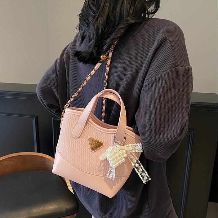 Bolso de mano de color de contraste popular de este año para mujer 2025 nuevo bolso de cubo más vendido bolso de mensajero casual de alta gama de todo fósforo