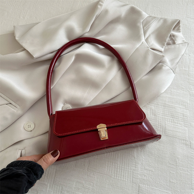 Temperamento simple bolso de hombro de bloqueo de color sólido para mujeres 2024 primavera y verano nuevo nicho de alta calidad bolso de brazo bolso de mujer