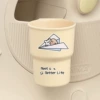 Beige plastic glass holder, airplane