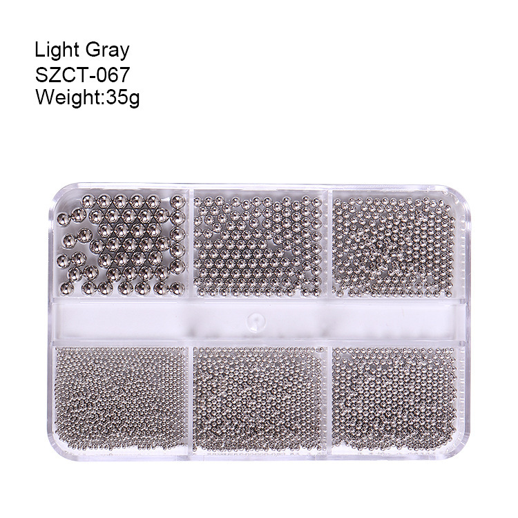 Accesorios de uñas transfronterizos al por mayor 6-grid nail aleación de acero cuentas oro plata tamaño mezclado decoraciones de uñas al por mayor