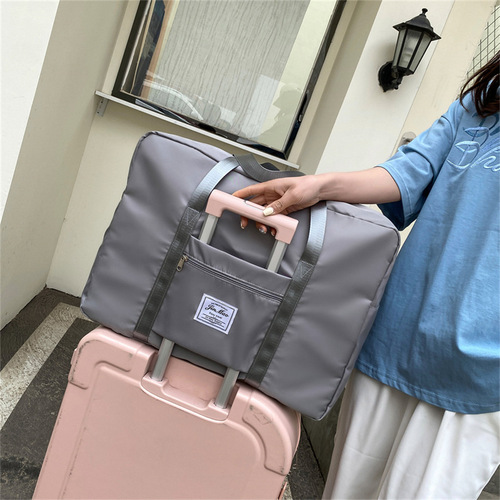 Wholesale famous travel bag for women, lightweight travel short-term storage, boarding luggage bag for men, fitness large capacity antenatal bag
