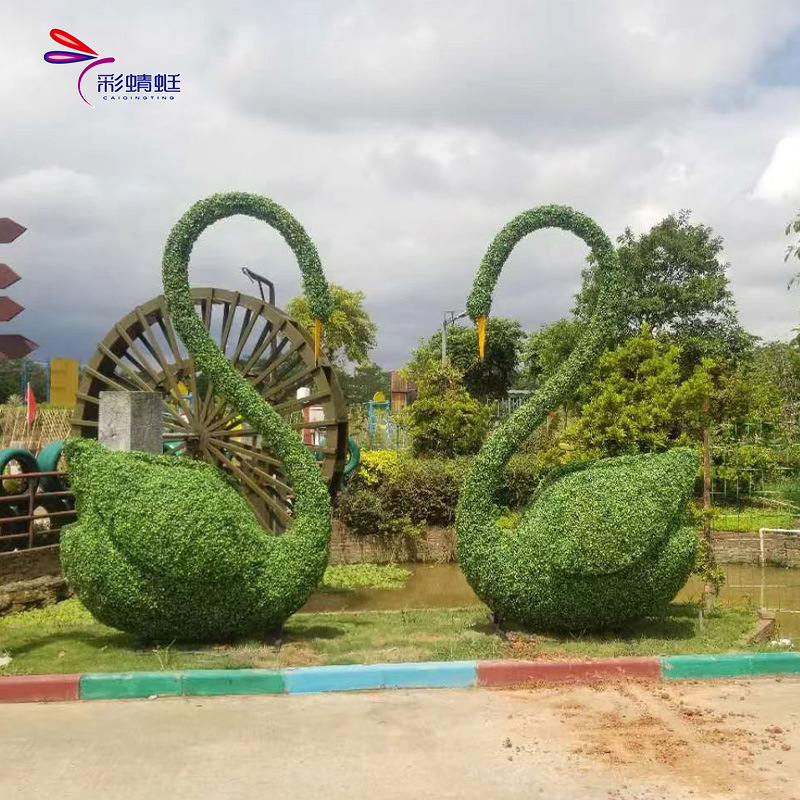 Fábrica de fotos de escultura verde transfronteriza a gran escala para hacer adornos de escultura verde luminosa en la intersección de la calle del parque al aire libre