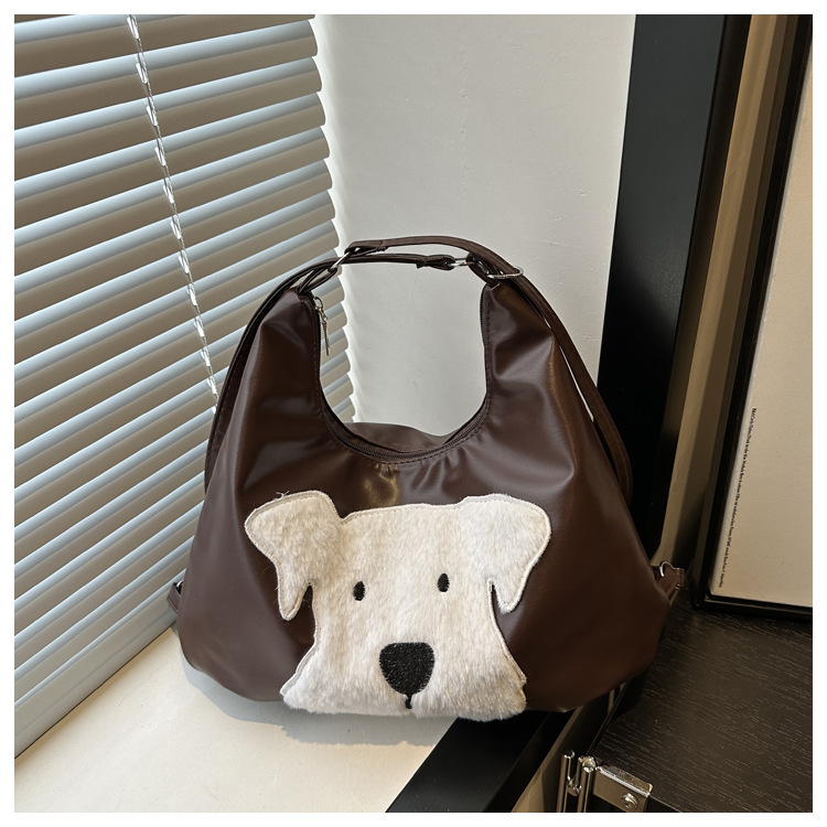The new autumn and winter 2024 fashion cartoon backpack with simple, individual and niche design, single-shoulder bag and commuter tote bag undefined