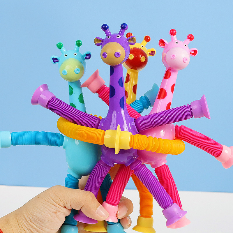 Luminoso de dibujos animados cambiable retráctil lechón jirafa niños bebé rompecabezas entre padres e hijos tubo de estiramiento interactivo juguete de descompresión