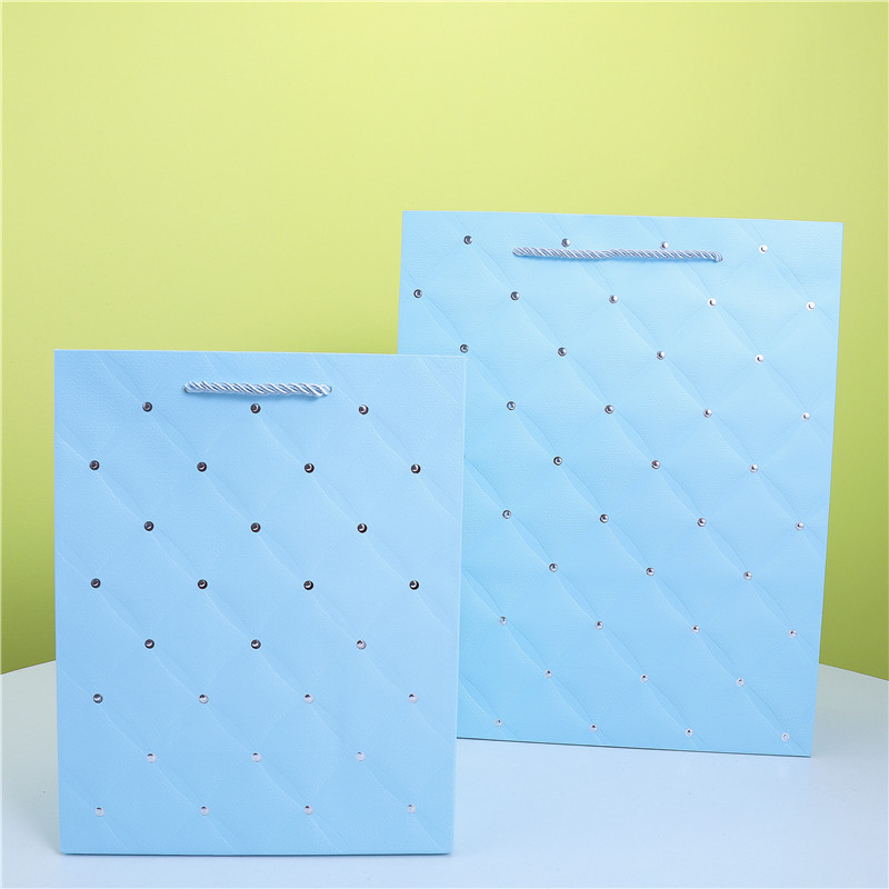 现货烫金加压纹白卡礼品纸袋子单色圆点烫金手提纸袋外贸包装纸袋