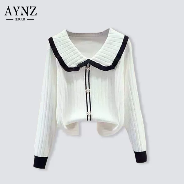 White doll, sweater, doll collar