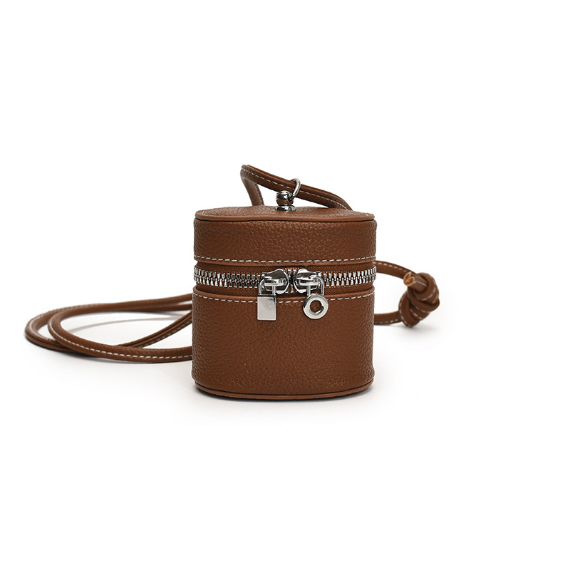 Bolso de hombro para niña coreana simple color sólido mini lindo bolso de cubo para bebé 2025 nuevo bolso de auriculares para niños marea