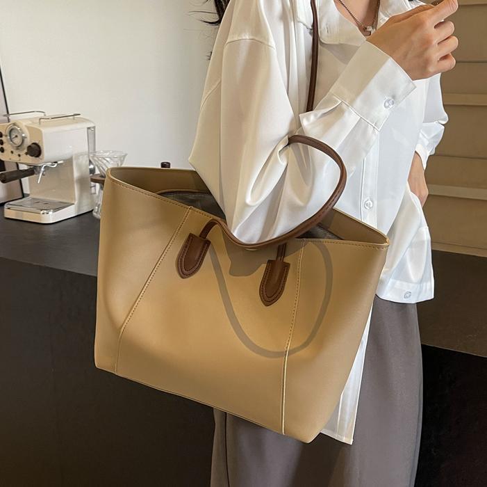 Este año, la popular bolsa de gran capacidad para mujeres 2026 nueva bolsa de brazo simple y casual, bolsa de hombro de viaje universal.