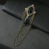 Golden brooch with tassels, trend silver suit, chain, pin