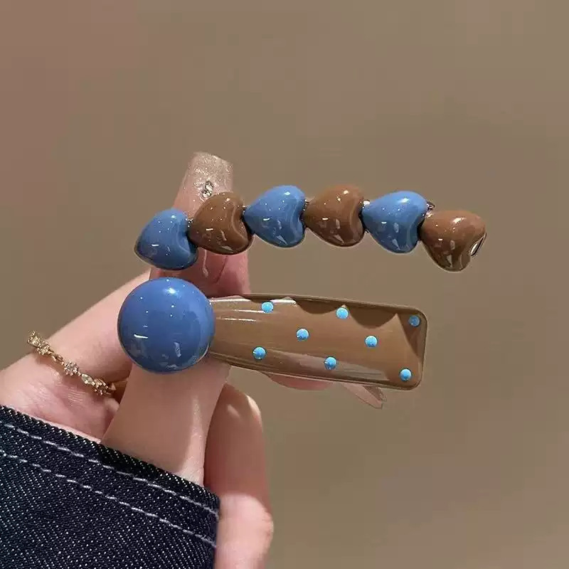 Clip de cabello de flor de leopardo para mujeres clip de cabello de alto nivel frente clip de frangeo 2025 nuevo clip lateral clip de cabello toque