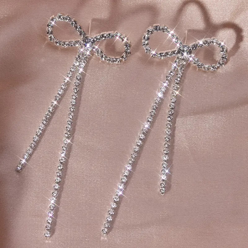 long fashionable sophisticated earrings with bow with tassels with…