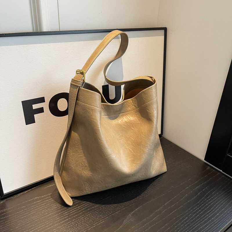 Ascellare di grande capacità per le donne 2024 nuova borsa tote da pendolarismo di nicchia in tinta unita di fascia alta, spalla singola_voghion.com