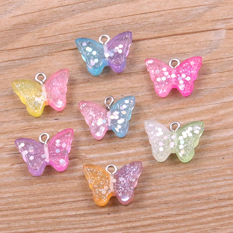 7 colores 14*19mmDIY resina accesorios brillante color a juego mariposa animal colgante encanto accesorios de la joyería