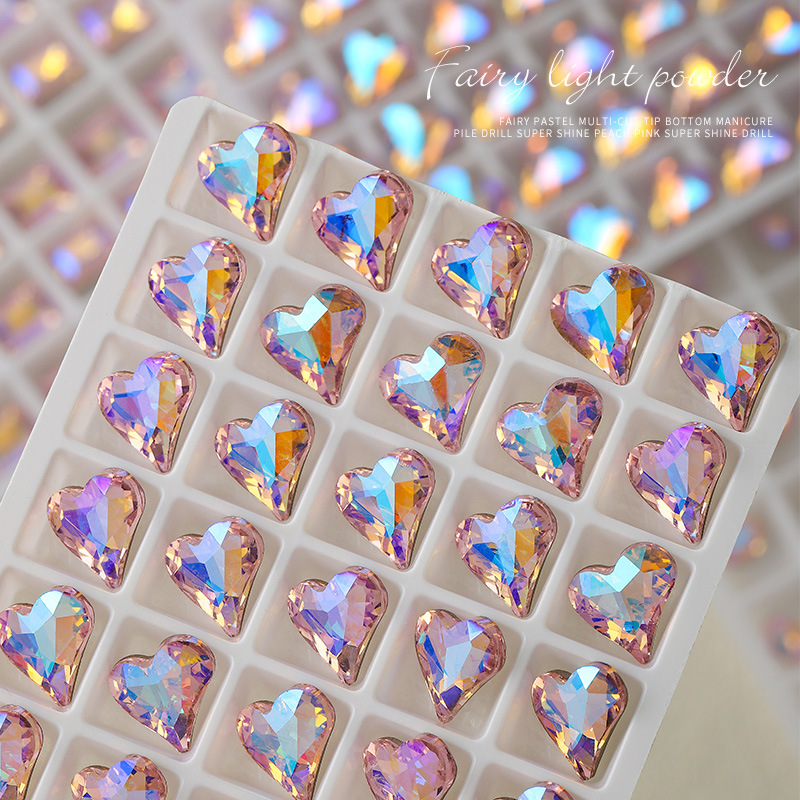 Venta al por mayor de uñas de diamante rosa claro, nuevas uñas de diamante de circonio de titanio multifacéticas con forma de corazón inclinado y punta, a la moda