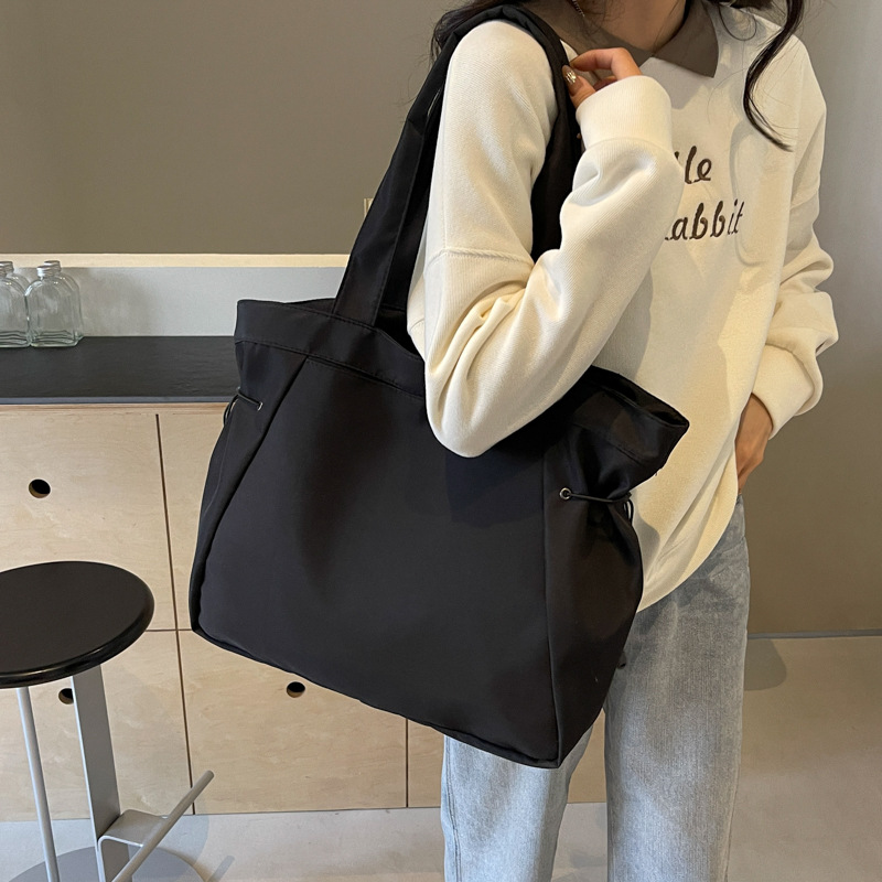 Bolso casual coreano de moda de gran capacidad de color puro 2024 primavera nuevo bolso de axila de un solo hombro ins de todo fósforo