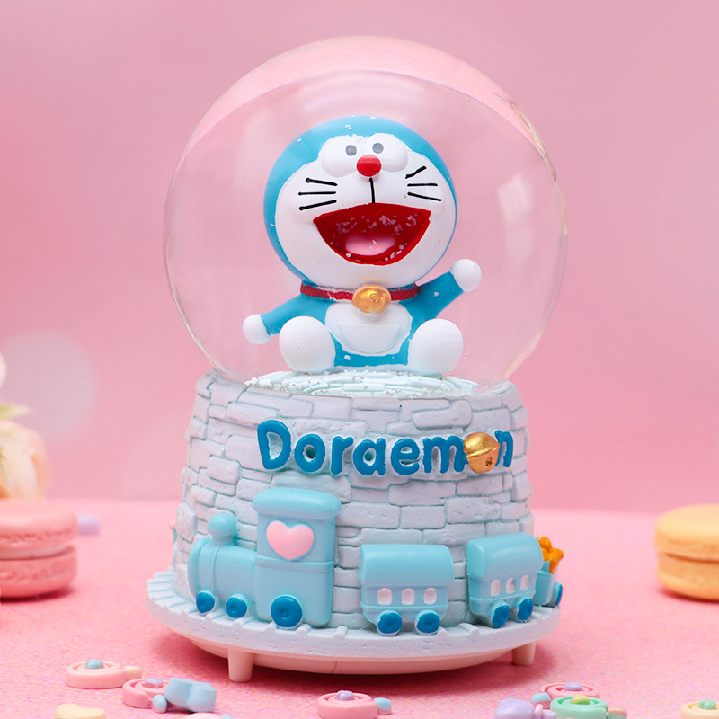 Linda campana tren azul gordo bola de cristal caja de música para niños y compañeros de clase regalo caja de música de nieve brillante