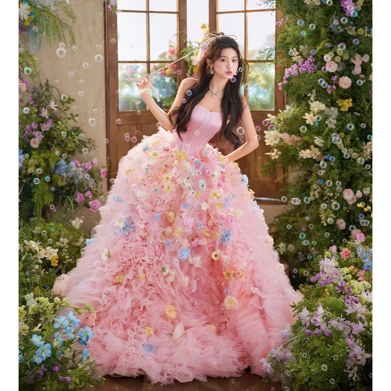 New pink wedding dress theme for couples' indoor photography at the photo studio, featuring a high-end, sweet style with floral strapless design and colorful tulle New pink wedding dress theme for couples' indoor photography at the photo studio, featuring a high-end, sweet style with floral strapless design and colorful tulle