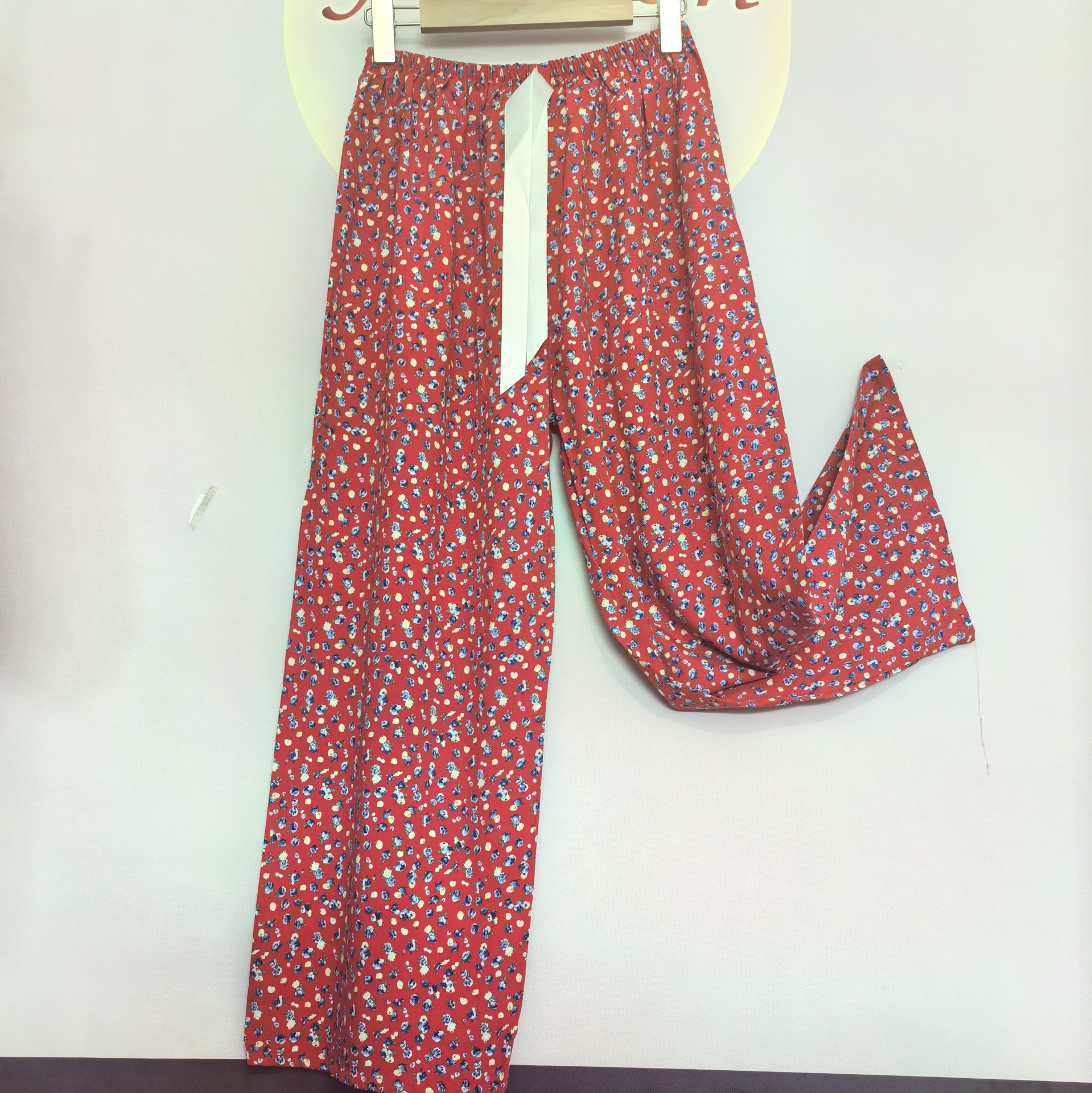 Small floral flowers on red background