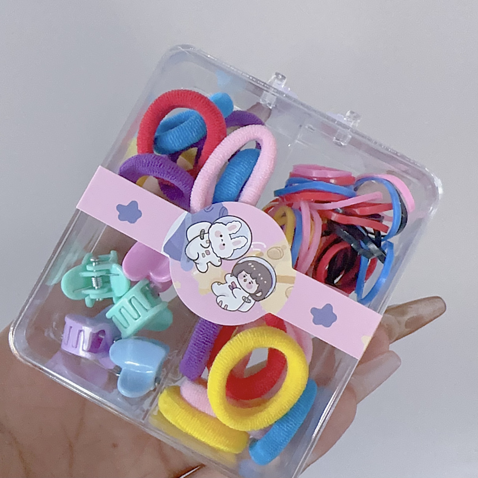 Al por mayor 2.5 pulgadas pulgar pequeño anillo de cabello nuevo niño no lesiones de cabello correa de color caja de chaqueta de cabello pequeña personalidad encantadora