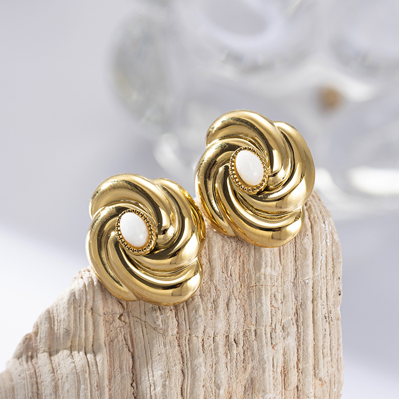 Taina estilo europeo clásico anillo jade blanco pernos de acero inoxidable de alta calidad personalidad giratoria pendientes de acero de titanio nicho femenino