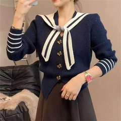 ヨーロッパスタイル V ネックバタフライボタンニットセーター女性のための 2025 冬の新しいスリムフィットと年齢を軽減するトップトレンディ