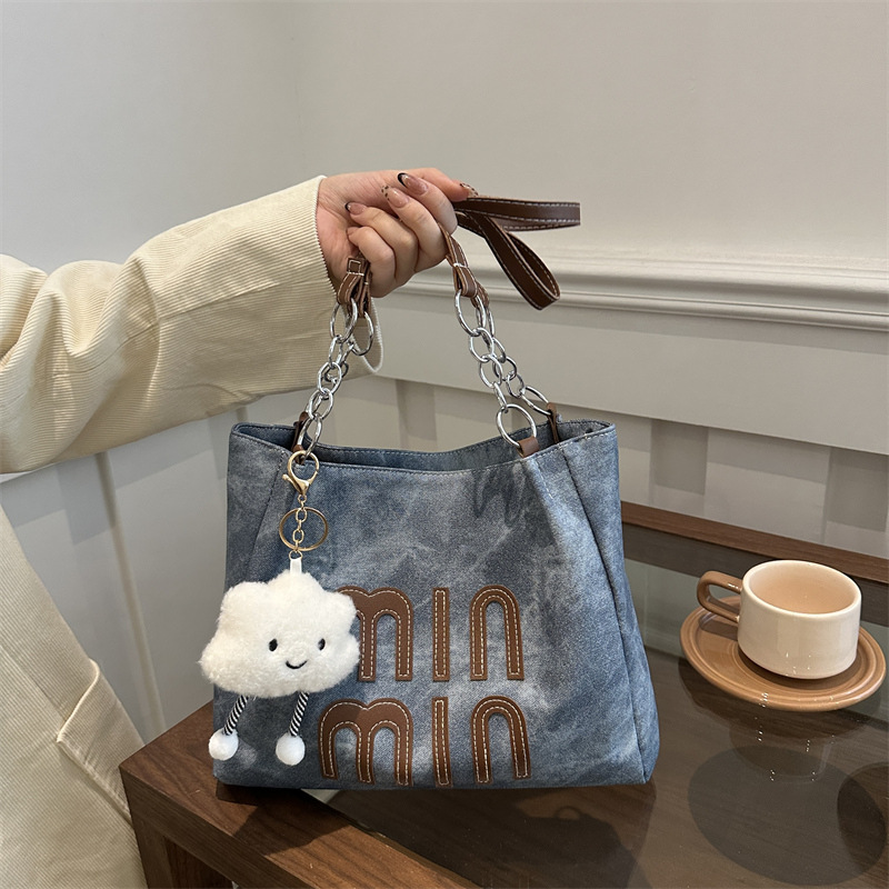 Bolsa de viaje de ocio para mujeres 2024 nueva bolsa de compras de hombro de textura simple de otoño y invierno