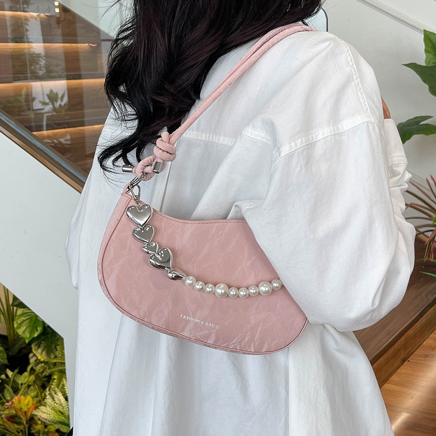Textura de celebridades de Internet, bolso pequeño de estilo occidental para mujer 2024 verano nuevo bolso de hombro de perlas, bolso de axila de mensajero de moda de todo fósforo