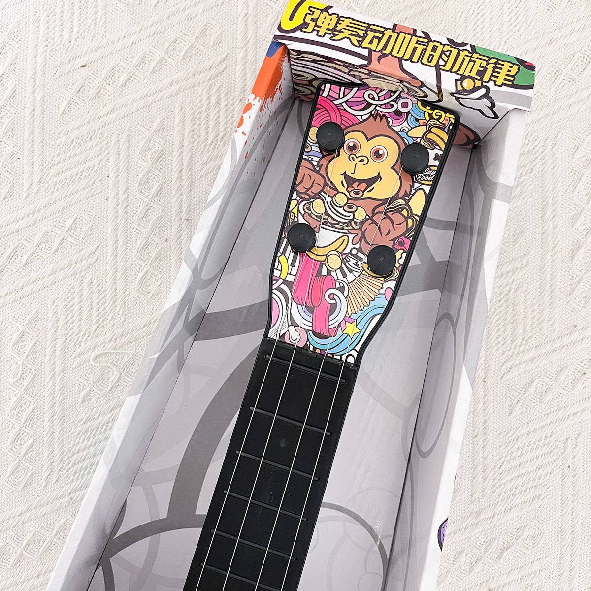 Niños graffiti ukulele DIY simulación tocable guitarra pequeña instrumento musical puzzle juguetes de educación temprana regalos de la institución