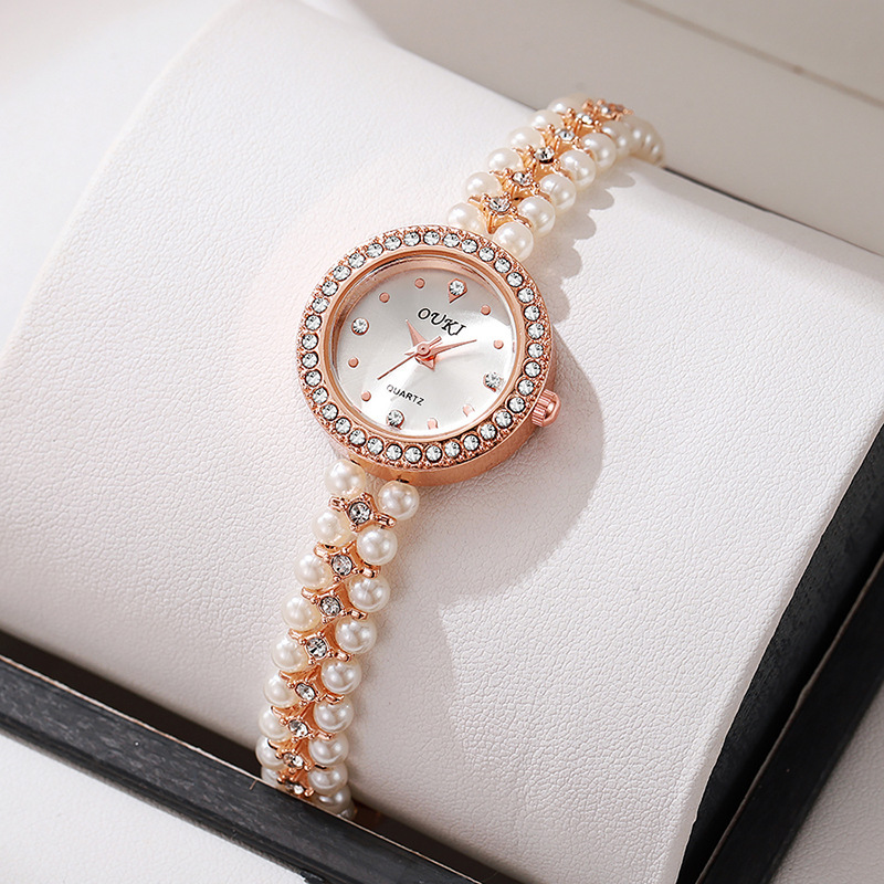 Reloj de pulsera de perlas con cara de gota de agua redonda de lujo ligero transfronterizo moda hecha a mano con cuentas regalo temperamento reloj de mujer al por mayor