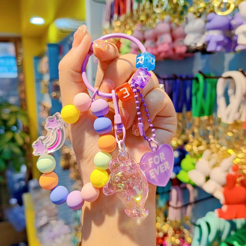 Nuevo acrílico delfín cuentas llavero bolsos creativos colgantes pequeños regalos frescos de cuentas de color al por mayor