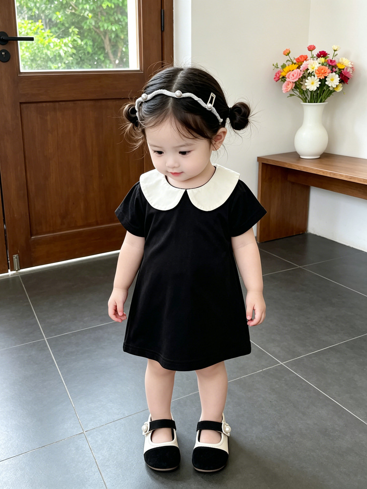 Bebé de verano vestido de estilo Hepburn bebé negro y blanco contraste muñeca cuello de manga corta A vestido de moda ropa infantil